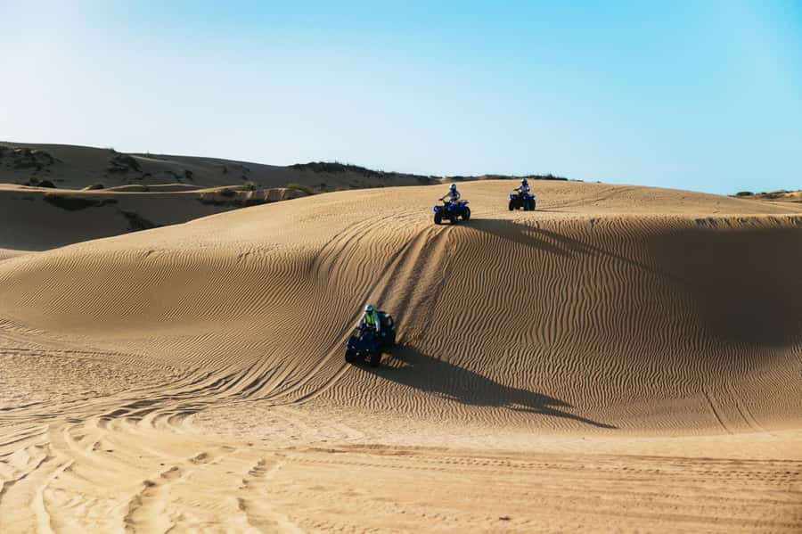 Essaouira Sand Dunes: Half Day Quad Bike Tour - Getting kitted up with clean helmets, gloves, and a wind jacket
