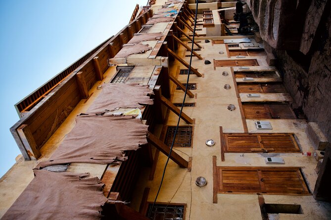 Fes Guided Sightseeing Tour with Luxury Car All Inclusive Tickets - The medina walking piece: Qissaria Al-Kifah and a university visit angle