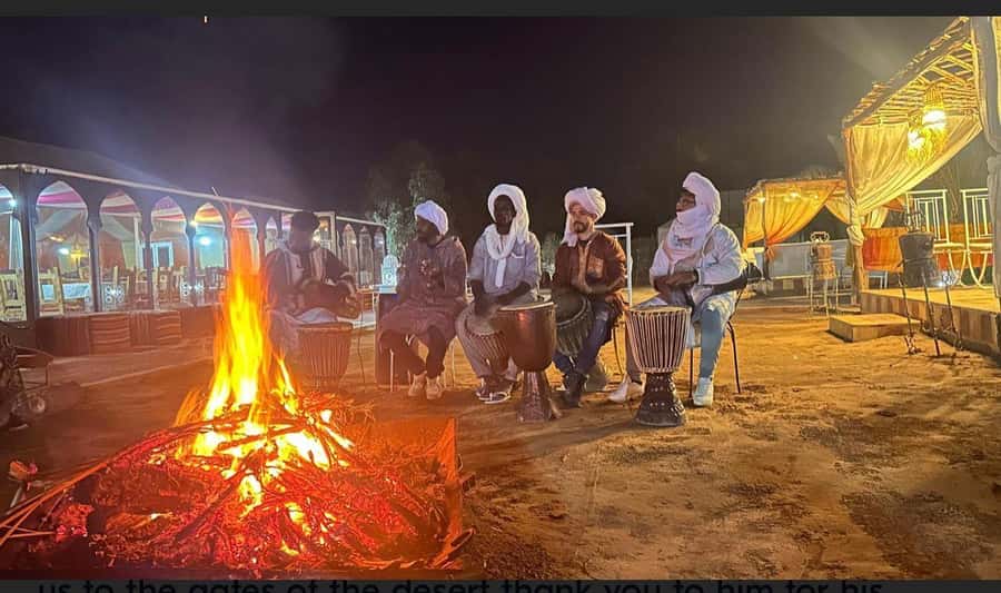 From Fes: 2-Day Merzouga Desert Trip w/Luxury Tent & Dinner - Arriving in Merzouga: camel ride, sunset timing, and sandboarding