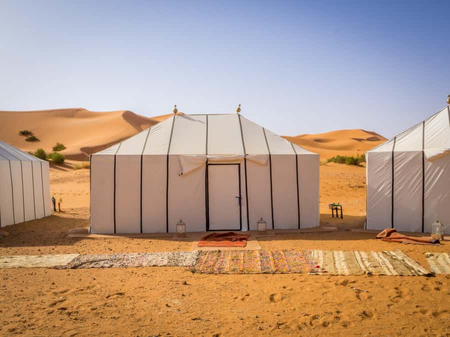 From Fes: 3-Day 2-Night Desert Tour to Marrakech - Luxury tent camp nights, campfire music, and sandboarding time