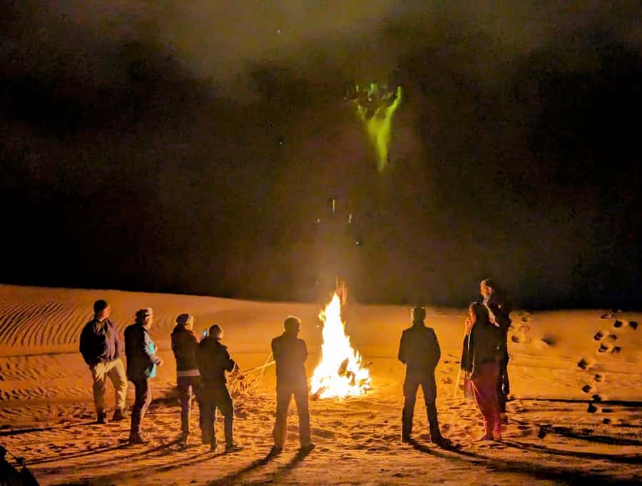 From Marrakech: Agafay Desert Sunset, Camel Ride, and Dinner - Moroccan dinner by the fire, with Berber music and more showtime