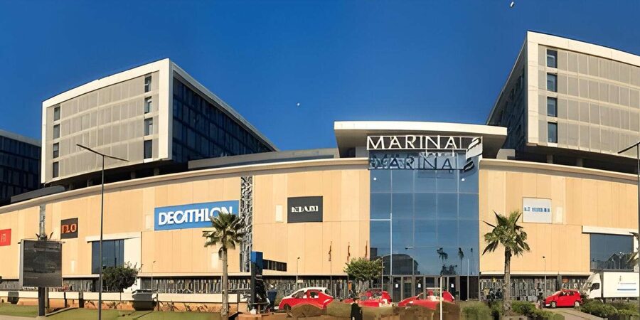 From Marrakech: Casablanca Day Trip Experience" - Mohammed V Square and the Cathedral: a classic Casablanca photo pair