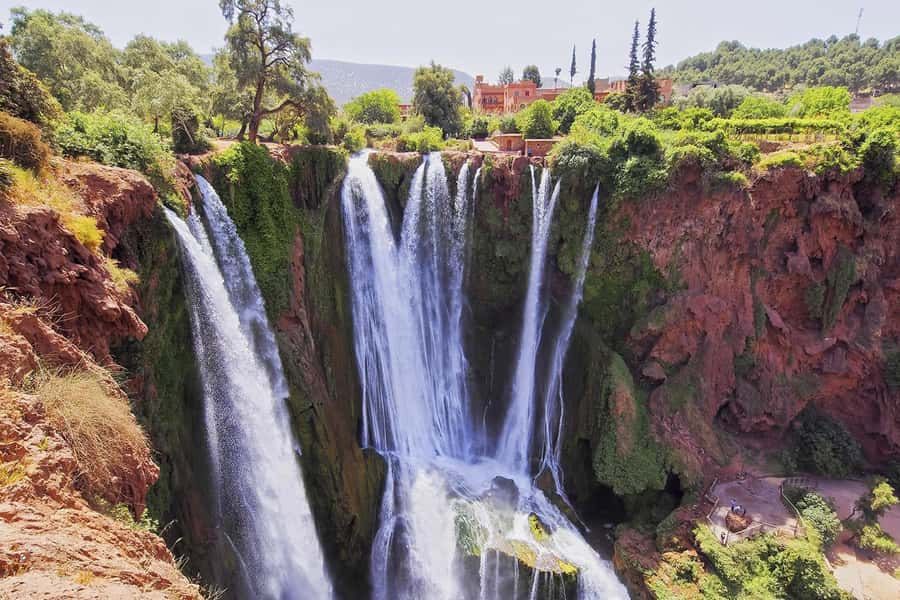 From Marrakech: Ouzoud Waterfalls Guided Hike and Boat Tour - Arriving at Ouzoud Waterfalls: Red Cliffs, Olive Groves, and Three Drops of Power