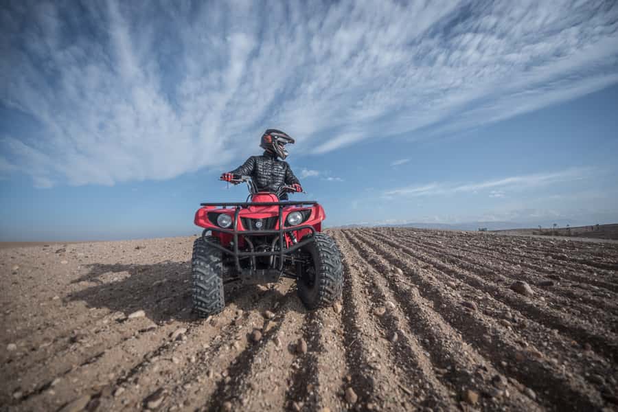 From Marrakech: Premium Agafay Desert Half-Day Quad Biking - Agafay Desert: Rock, Dry Rivers, and Atlas Views