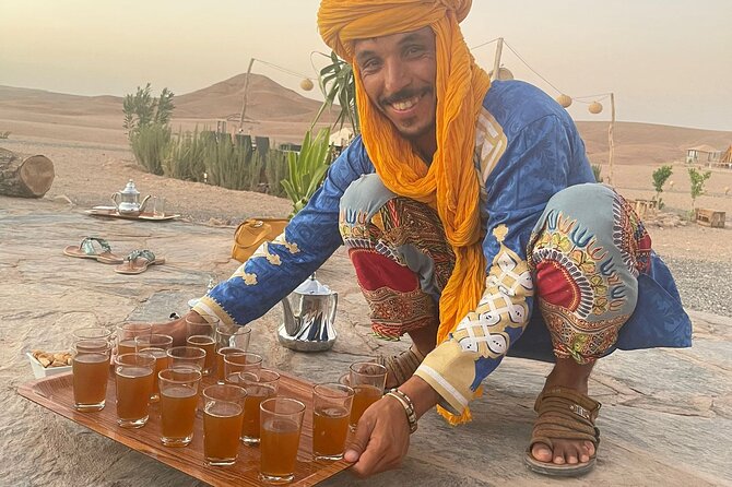 Magical Evening in the Agafay Desert: Dinner, Shows & Adventures - Moroccan dinner, mint tea, and bottled water under the night sky