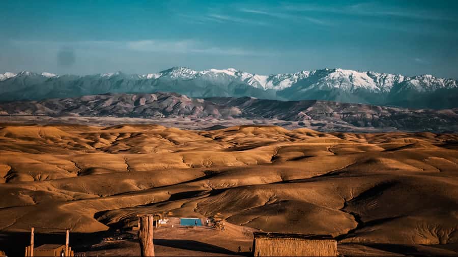 Marrakech: Agafay Desert Dinner, Camel Ride, and Music Show - Getting Picked Up in Marrakech and Driven Into the Countryside