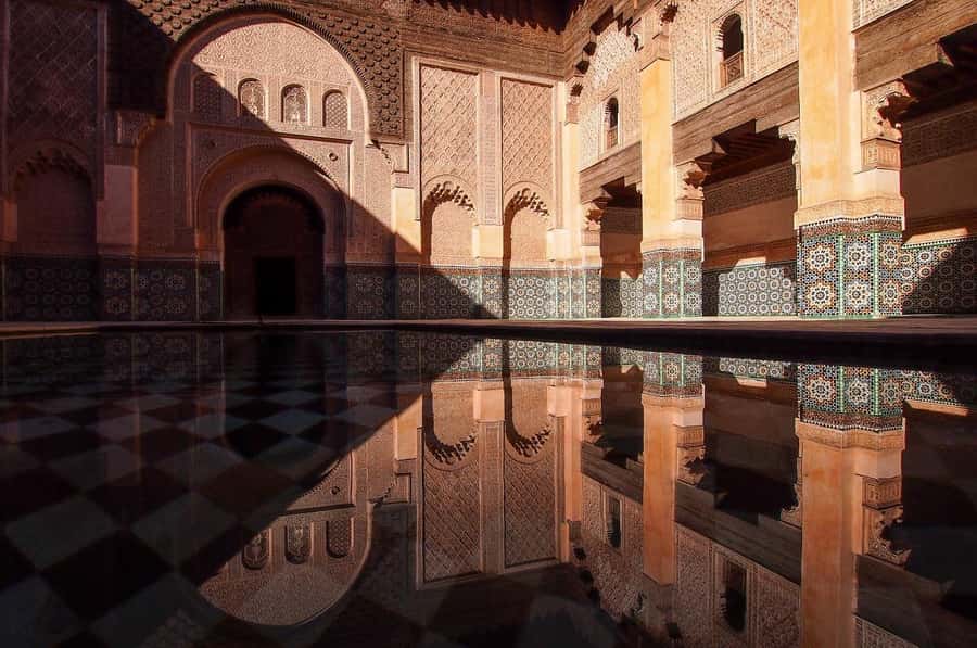 Marrakech: Ben Youssef, Secret Garden, & Souks Walking Tour - Jemaa el-Fnaa: street life, quick photos, and an orientation to the city