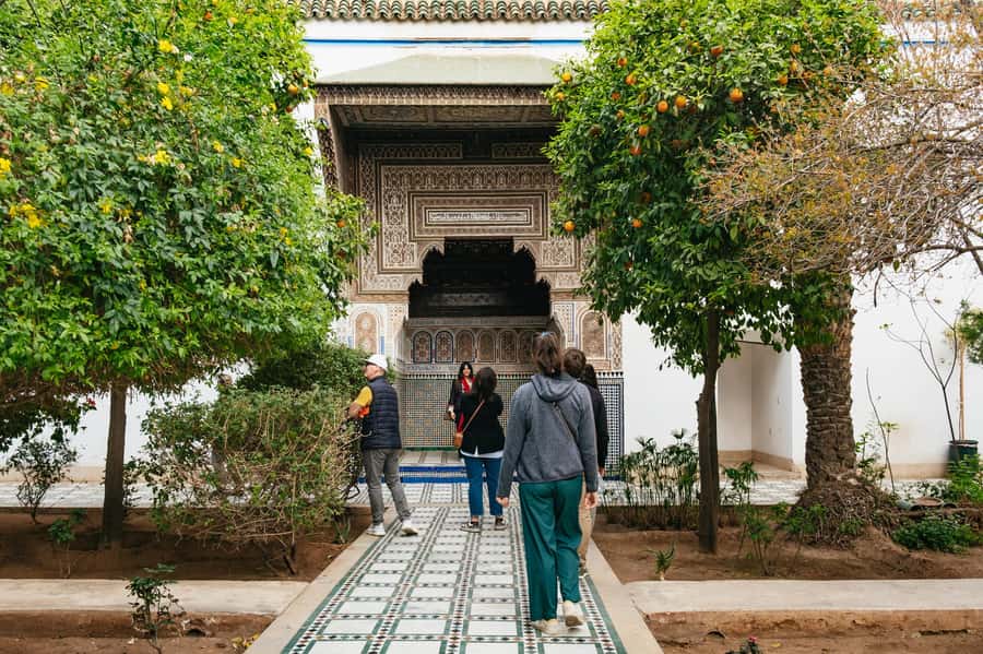 Marrakech: Saadian Tombs & Bahia Palace, Medina Guided Tour - Koutoubia Mosque minaret and the quick photo stops that set the tone