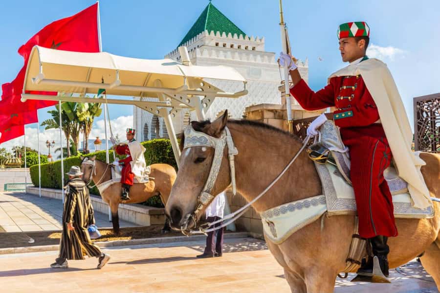 Rabat: Guided City Tour with Mausoleum Mohammed V Visit - Royal Palace exterior view and the passport rule