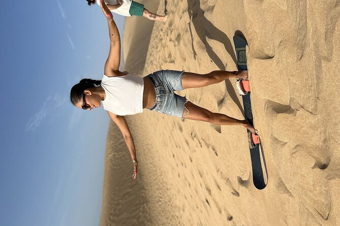 Sandboarding with Panoramic Views of the ocean and Agadir Desert - Tamri National Park sandboarding with ocean on the horizon